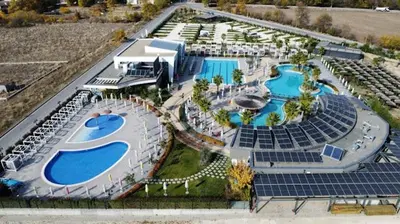 an aerial view of a resort with two pools at Харизма in Hisarya