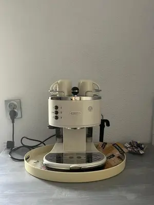 a white coffee maker sitting on top of a counter at Apаrtment Melnik home in Melnik