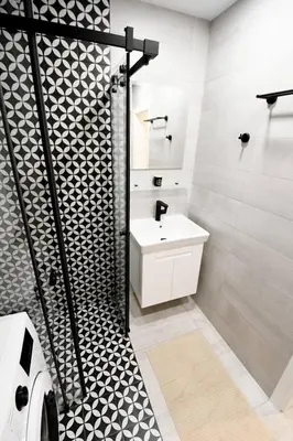 a bathroom with a white sink and a shower at MD Your Fancy Place in Sofia