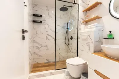 a bathroom with a shower with a toilet and a sink at Smart Studio in the heart of Sofia in Sofia