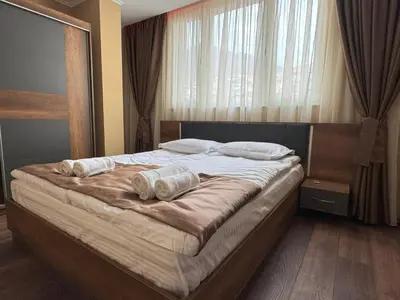 a bedroom with a bed with two pillows on it at ApartmentSpiceDevin in Devin