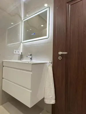 a bathroom with a sink and a window at ApartmentSpiceDevin in Devin