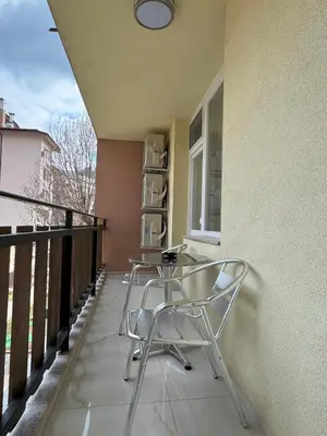 a pair of chairs sitting on a balcony at ApartmentSpiceDevin in Devin