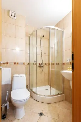 a bathroom with a shower and a toilet and a sink at 'Chamonix' in Bansko - 1 bedroom - SKI IN&OUT - Free spa in Bansko