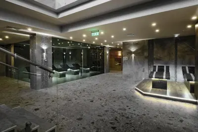 a large room with a lobby with couches and a lobby at Studio DeLuxe King with mountain view and spa rilski in Bansko
