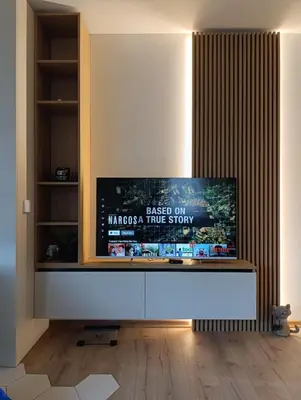 a living room with a flat screen tv on a wall at Koko's Cozy Apartment - free Garage Netflix and Balcony in Sofia