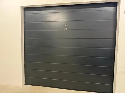a garage door in a room at Koko's Cozy Apartment - free Garage Netflix and Balcony in Sofia