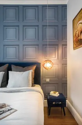 a bedroom with a bed and a blue wall at Landmark Luxe 2BR Apt with Parking in Sofia