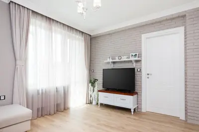 a living room with a flat screen tv on a table at Casa Dolce far niente , in Blue, PARKING in Sofia