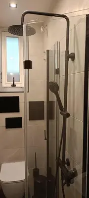 a shower with a glass door in a bathroom at Urban Comfort - Central 1BDR near Vitoshka & NDK by Flat Mаnager in Sofia