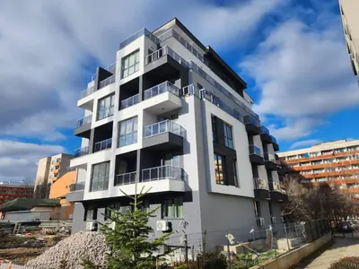 a white building with balconies on the side of it at Continental studios 2 in Sofia