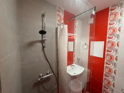 a small bathroom with a toilet and a shower at Apart-Tundzha 6 in Sofia