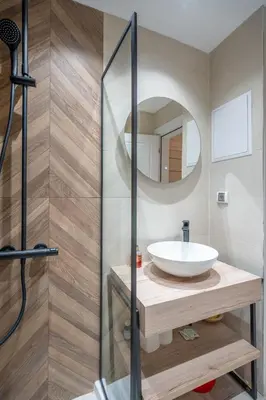 a bathroom with a sink and a mirror at Elegant & Stylish 2-Bedroom Apartment in Sofia