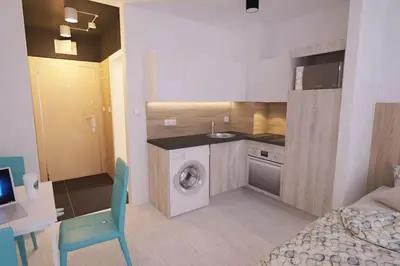 a kitchen with a washing machine in a room at Natan Royal in Sofia