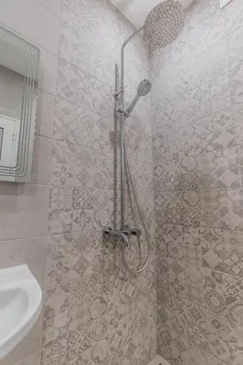 a shower stall in a bathroom with a sink at Vitoshka Inn - R1 in Sofia