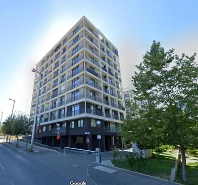 a tall building on the corner of a street at Scandi Suite Business & Leisure in Sofia
