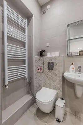 a bathroom with a toilet and a sink at Vitoshka Inn - R2 in Sofia