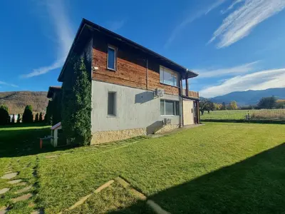 a house in the middle of a field at Vila Nikol Apt #3 in Raduil