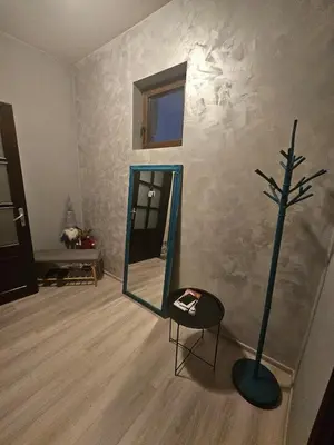 a room with a mirror and a tree on the wall at Hot Spot 2bdrm apartment 1 in Sofia