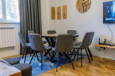 a dining room with a table and chairs at 35 Seconds Away From the Main Street, Free Secured Parking in Sofia