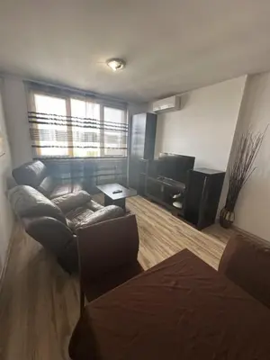 a living room with a couch and a tv at Luxury Cult & private parking in Sofia