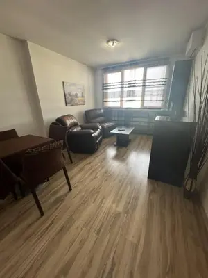 a living room with a couch and a table at Luxury Cult & private parking in Sofia