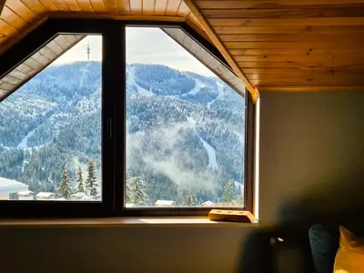 a window in a room with a view of a mountain at Nordic Sunset Retreat in Pamporovo