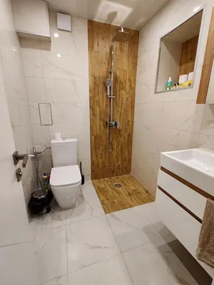 a bathroom with a toilet and a shower and a sink at Дрийм in Plovdiv