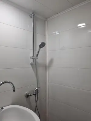 a bathroom with a shower and a toilet in it at Къща за гости ВИРА in Yasă-Koriya