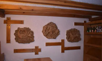 a wall with wooden decorations on a wall at Ловна резиденция ДЛС Извора in Devin