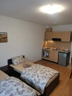a small room with two beds and a kitchen at Pirin Views Aspen A337 in Razlog