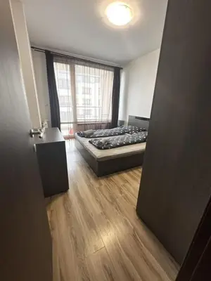 an open door to a room with a bed at Metropolitan Paradise & private parking in Sofia