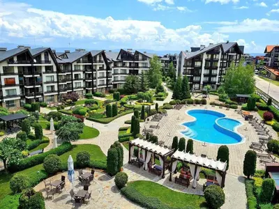 an aerial view of an apartment complex with a swimming pool at Cozy SPA Retreat with free Bottle of Wine in Aspen Golf in Razlog
