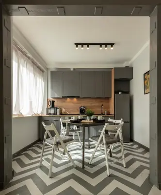 a kitchen with a table and chairs in a room at Downtown Stylish Flat in Sofia
