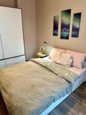 a bedroom with a bed with two pillows on it at Superb 2 Bedroom Top Central Apartment in Sofia