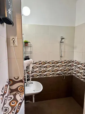 a bathroom with a sink and a shower at Superb 2 Bedroom Top Central Apartment in Sofia