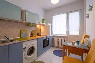 a kitchen with a sink and a washing machine at Little HoMe with a Park View by Flat Mаnager in Sofia