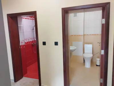 a bathroom with a toilet and a sink at ADVENTURE apartments Trigrad in Trigrad