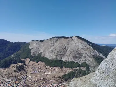 an aerial view of a town in a mountain at ADVENTURE apartments Trigrad in Trigrad