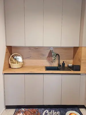 a kitchen counter with white cabinets and a sink at Your Home in Plovdiv with Free Private Parking in Plovdiv