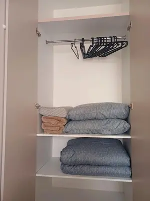 a group of towels on shelves in a closet at Your Home in Plovdiv with Free Private Parking in Plovdiv