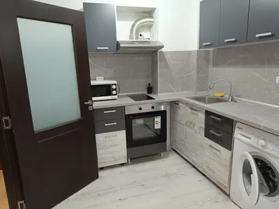 a kitchen with a washing machine and a microwave at One-Bedroom Apartment-14 Filip Makedonski 49B in Plovdiv