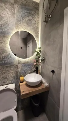 a bathroom with a sink and a mirror at Studio79 in Plovdiv