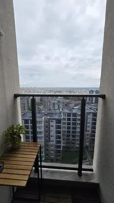 a balcony with a table and a view of a city at Studio79 in Plovdiv