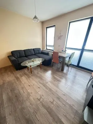a living room with a couch and a table at Paradise Comfort in Sofia