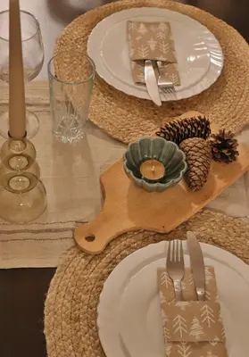 a table with white plates and silverware on a table at Gardenia Apartment Pamporovo in Pamporovo