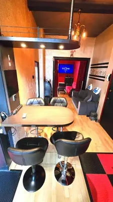 a room with a table and chairs and a living room at Sofia's Gem Apartment - Prime Location in Sofia