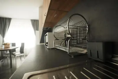 a kitchen with a drying rack on the wall at Royal nest in Sofia