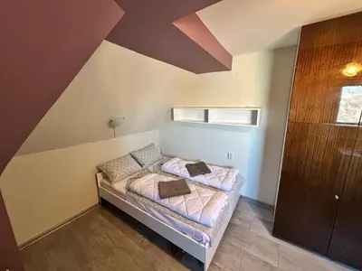 a small bedroom with a bed in a room at River Nest in Plovdiv