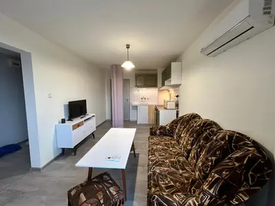 a living room with a couch and a table at River Nest in Plovdiv